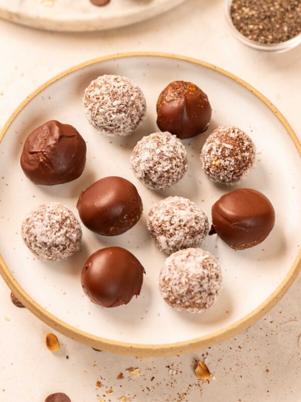 peanut butter oats energy balls with dates served on a white plate