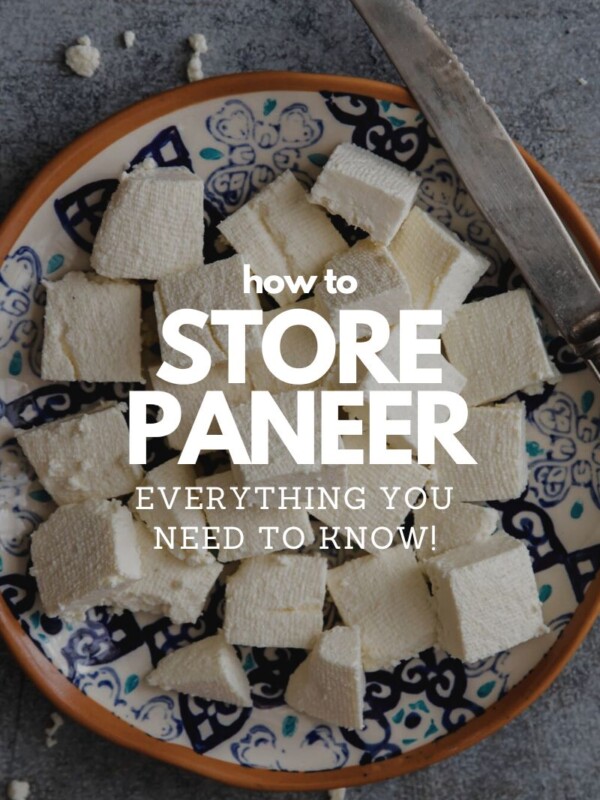 cubes of paneer on a plate with a butter knife
