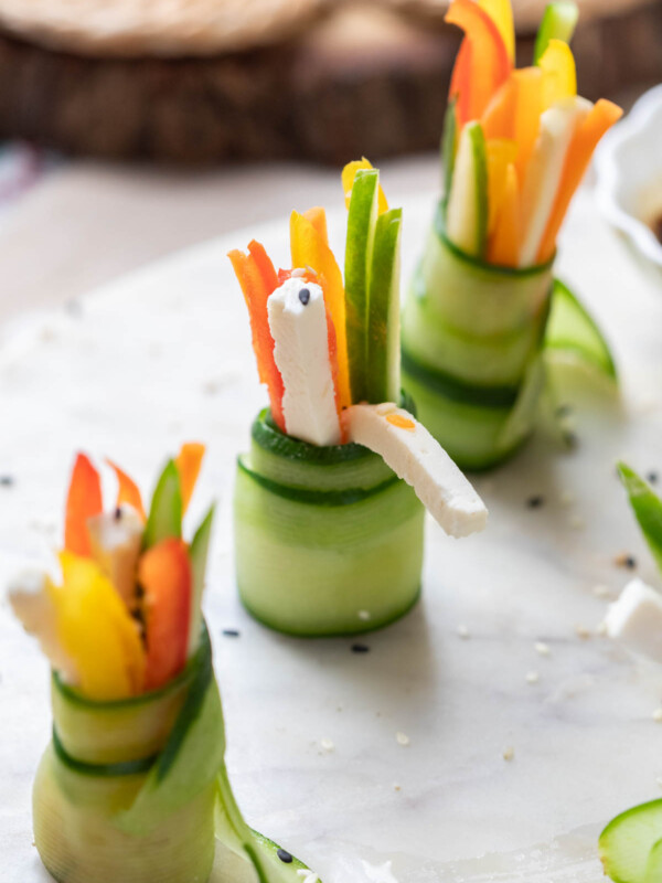 cucumber rolls served on a white platter