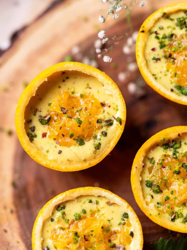 orange makhana pudding served in orange peel bowls