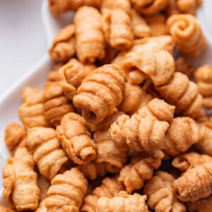 a close up image of kulkuls to show the crispy texture