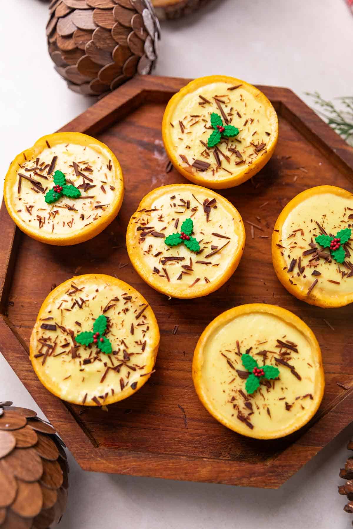 orange posset served on a wooden platter