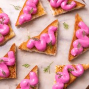 an image of several paneer toasts served on a round white platter