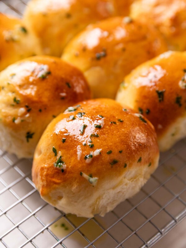 a close up image of freshly baked air fryer dinners rolls