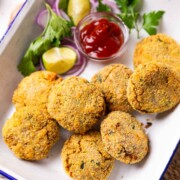 air fryer cutlet served in a white dish with accompaniments