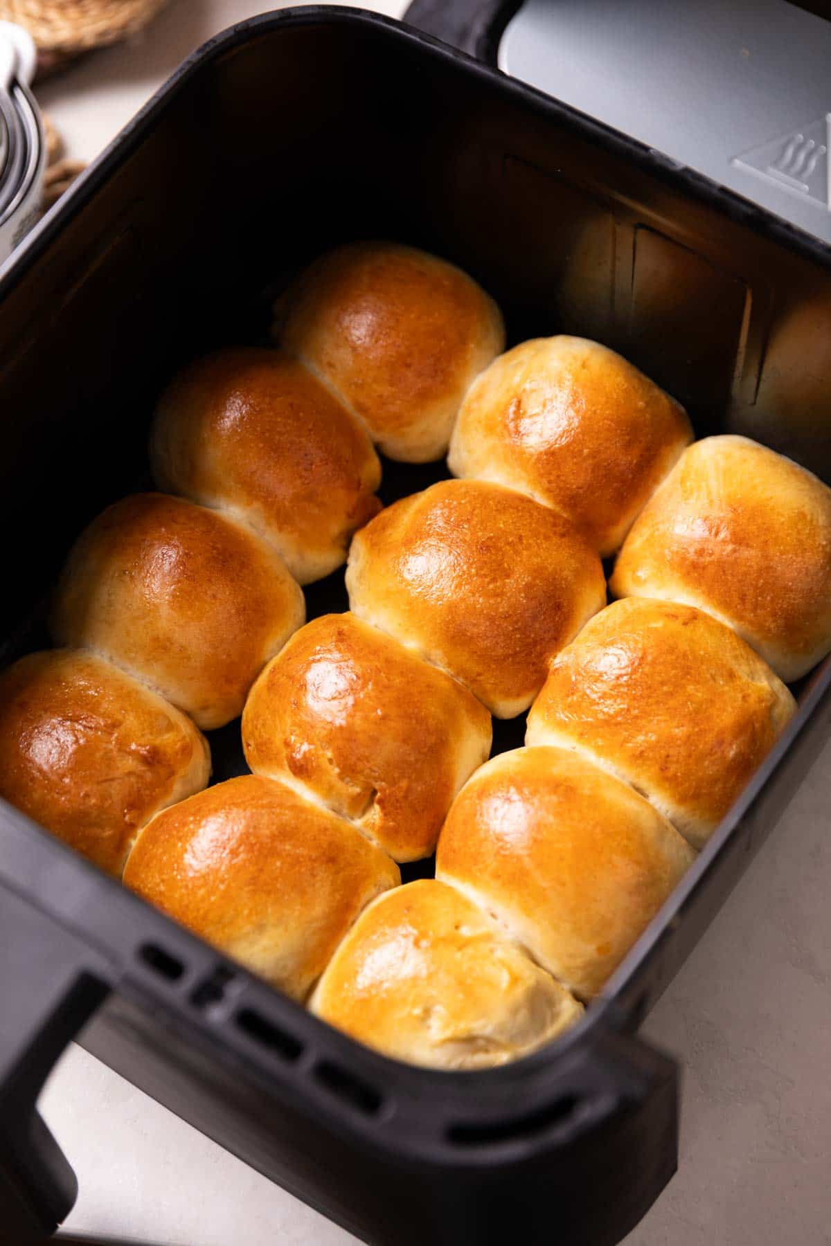 freshly baked dinner rolls in an air fryer