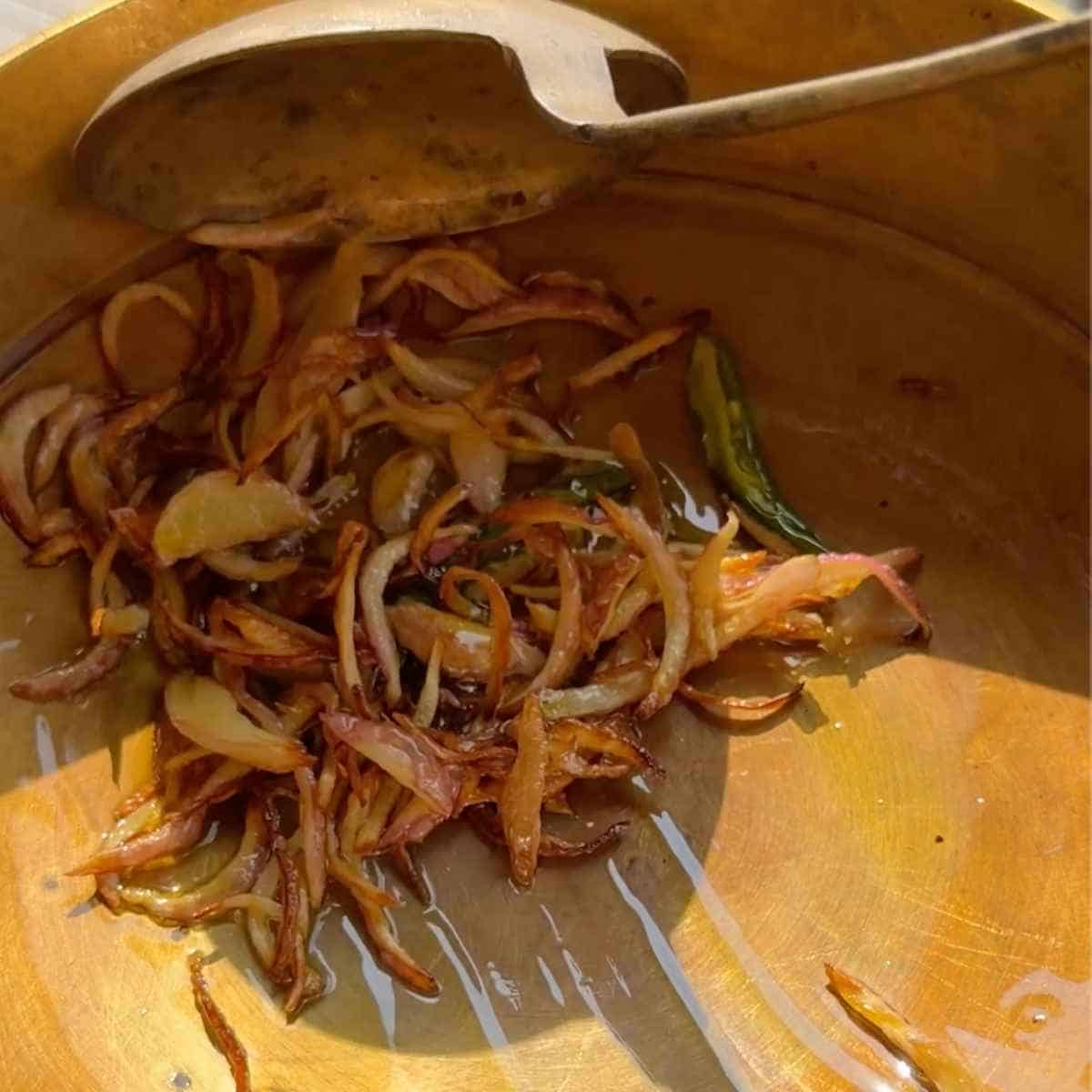 dahi tadka recipe - step 4 - cook onions and chillies until golden brown