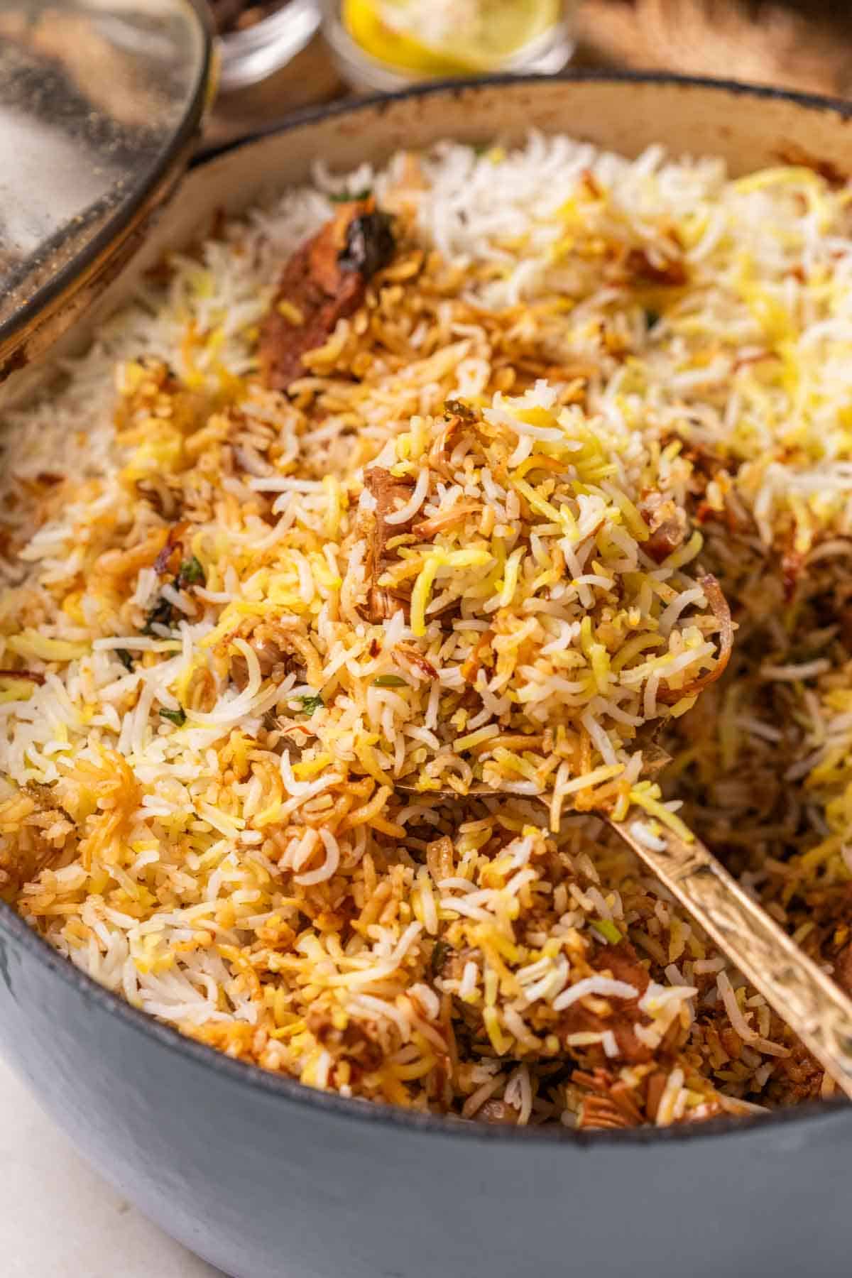 jackfruit biryani in a handi with ladle