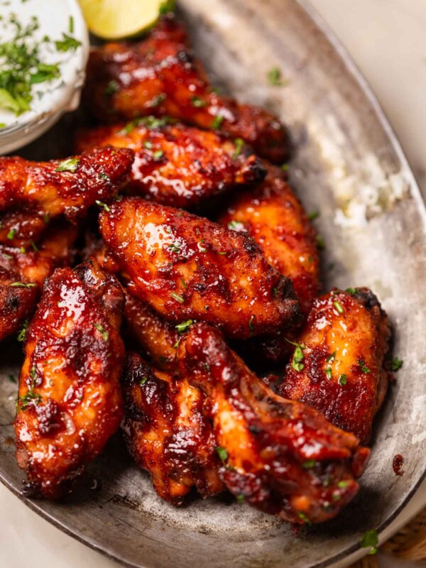 air fryer spicy bbq chicken wings served on a platter with accompaniments