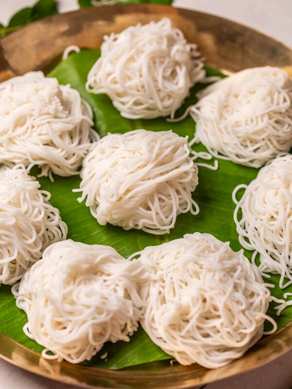 Rice idiyappams served on banana leaf in a plate
