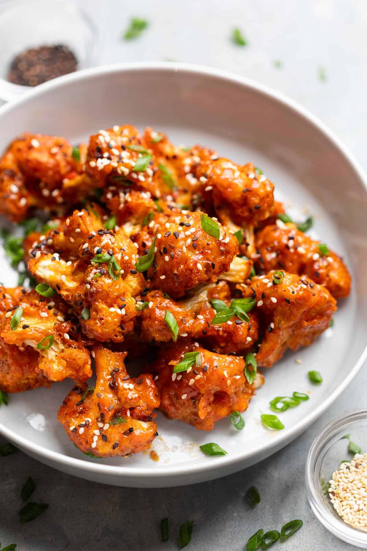 air fryer bang bang caulifower served on a white plate