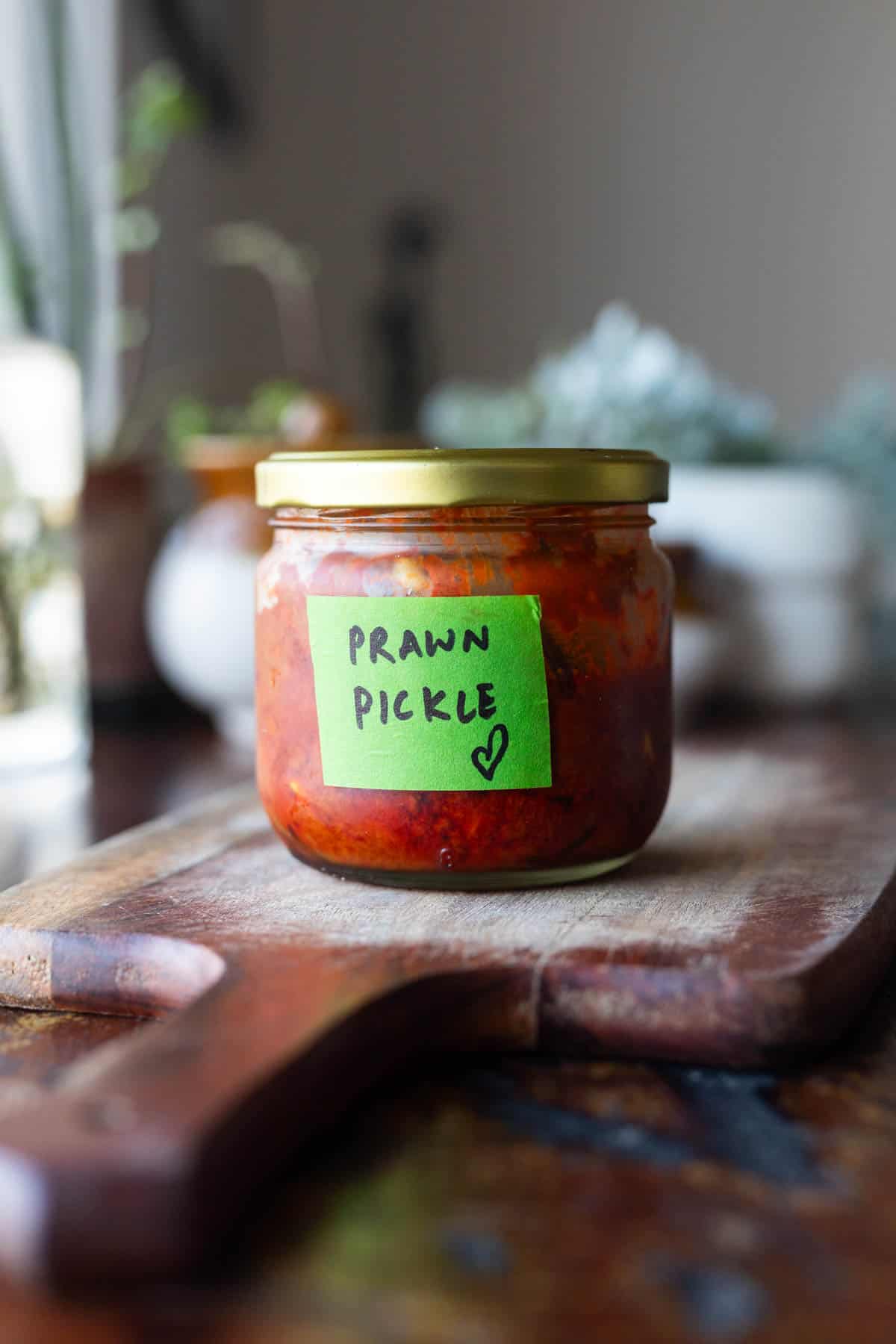 A bottle of prawn pickle labelled in green tape