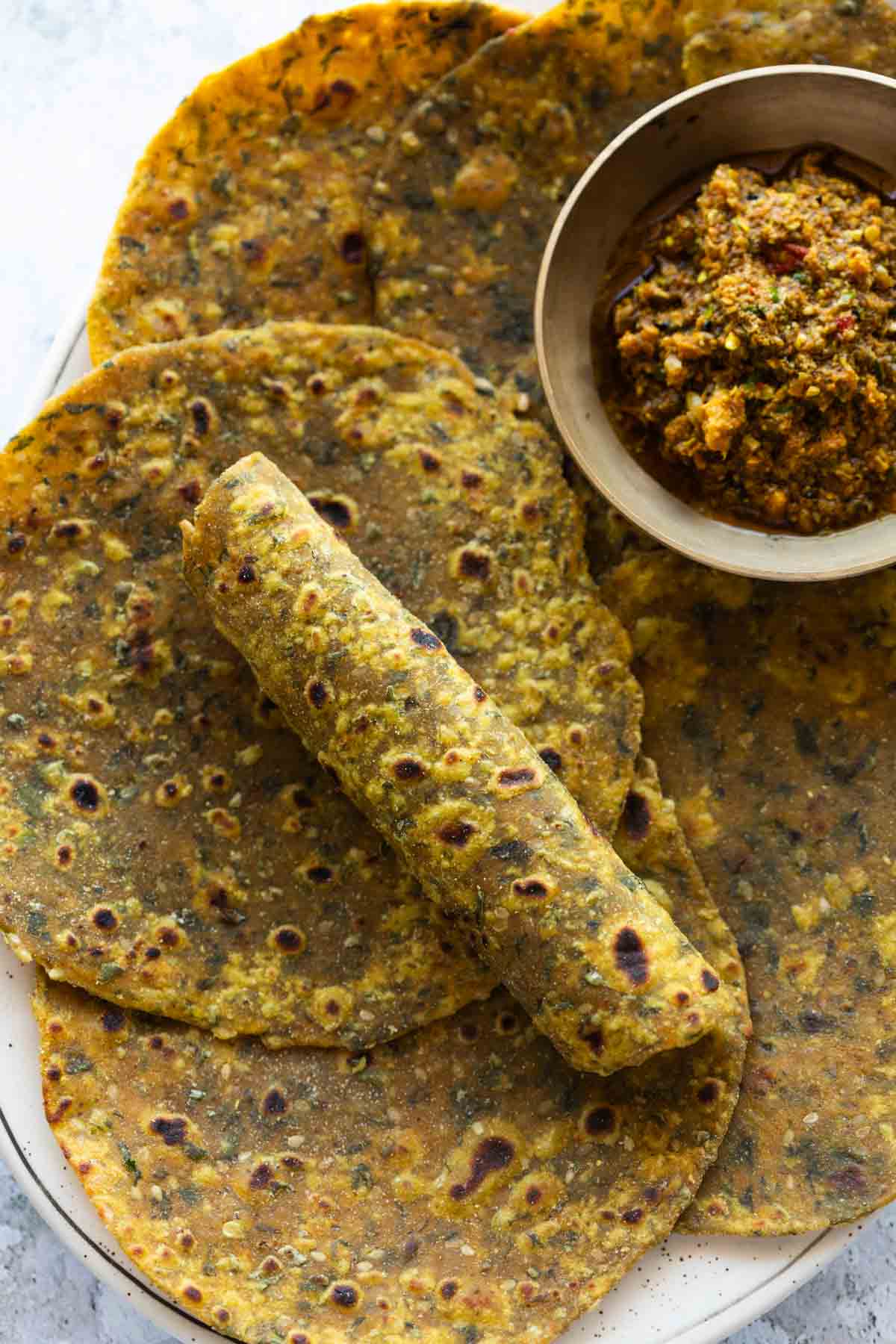 freshly made methi thepla served with pickle