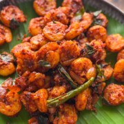 kerala prawn roast served over a banana leaf